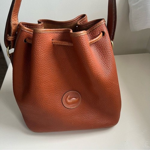 Dooney & Bourke Vintage Bucket Bag Purse Leather Brown Cognac Duck Logo Classic - Image 1