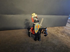 LEGO&reg; 6009 Black Knight is It features a knight minifigure, a horse, two swords.