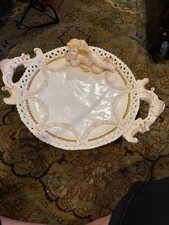 vintage porcelain decorative tray referred to as a "cherub platter" or "putti bo