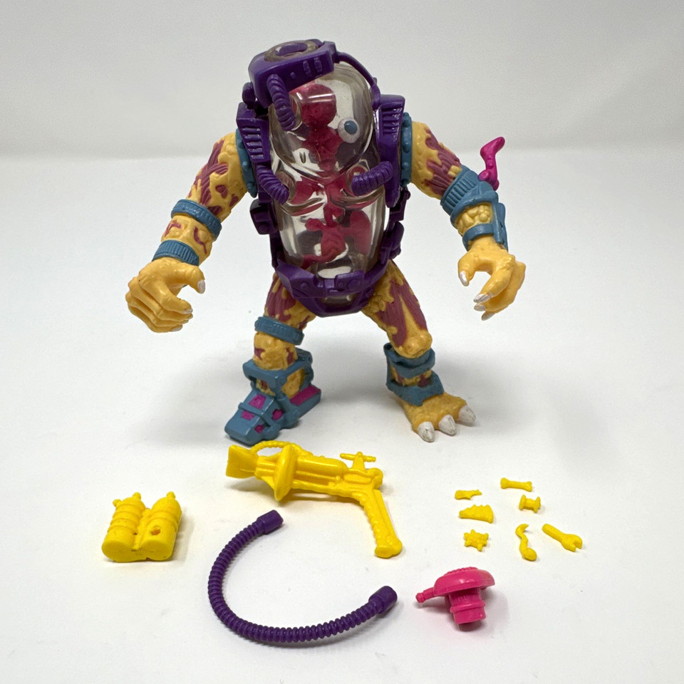 A 100% complete 1990 TMNT Mutagen Man figure — a notoriously hard-to-find character with all accessories intact, a white whale for any 80s/90s toy collector.