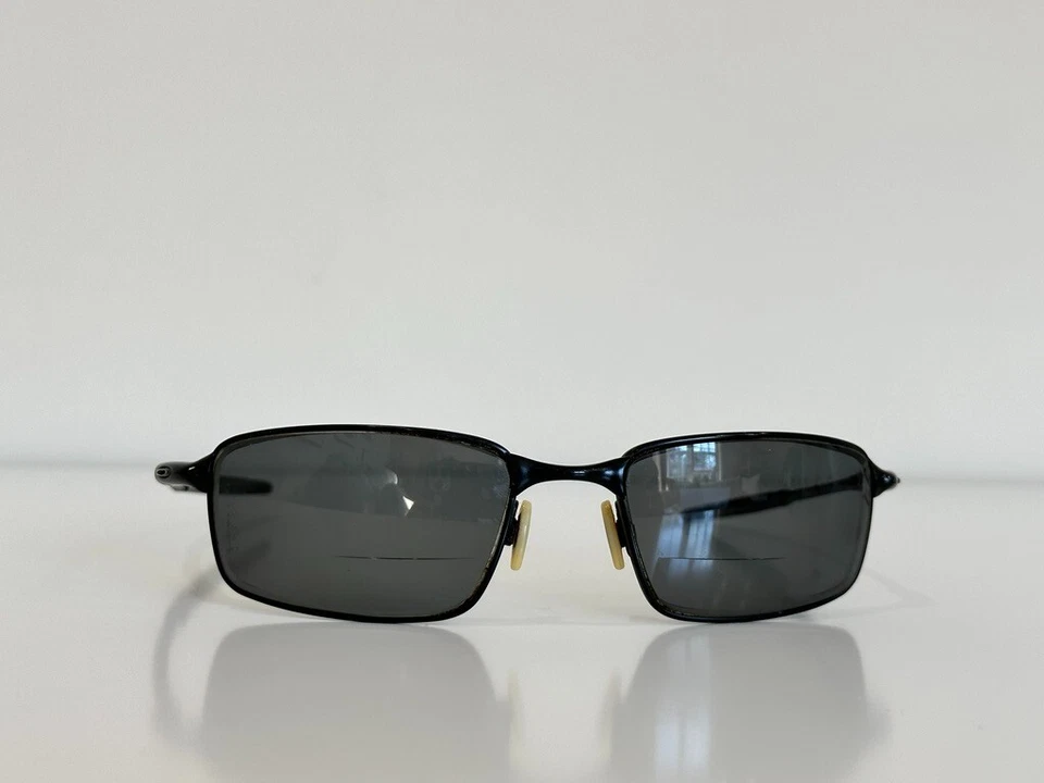 Gafas de sol Oakley 12-877 de alambre cuadrado negras para hombre 58-20 SOLO MARCO Foto 2 de 4