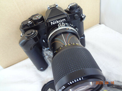 Near Mint Nikon FE SLR Camera Black body w/75-105/f3.5-4.5,MD-12