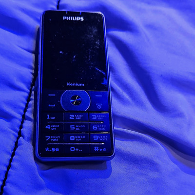 Used Philips Xenium Genius 1560 Bar Cell Phone Keypad 4GB Black
