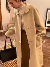 Beige long coat with toggle buttons