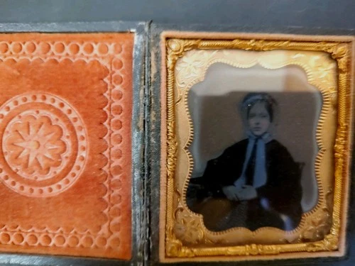 Daguerreotypes of woman, 1/4th plate, in leather embossed case