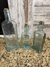 Lot of 3 Embossed Medicine Apothecary Bottles Dr. W B Caldwell & Rawleigh’s