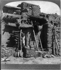 A Moki squaw reaching home with precious water carried two miles - Old Photo