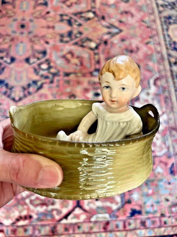 Antique Hand painted piano baby in basket porcelain possibly German Heubach