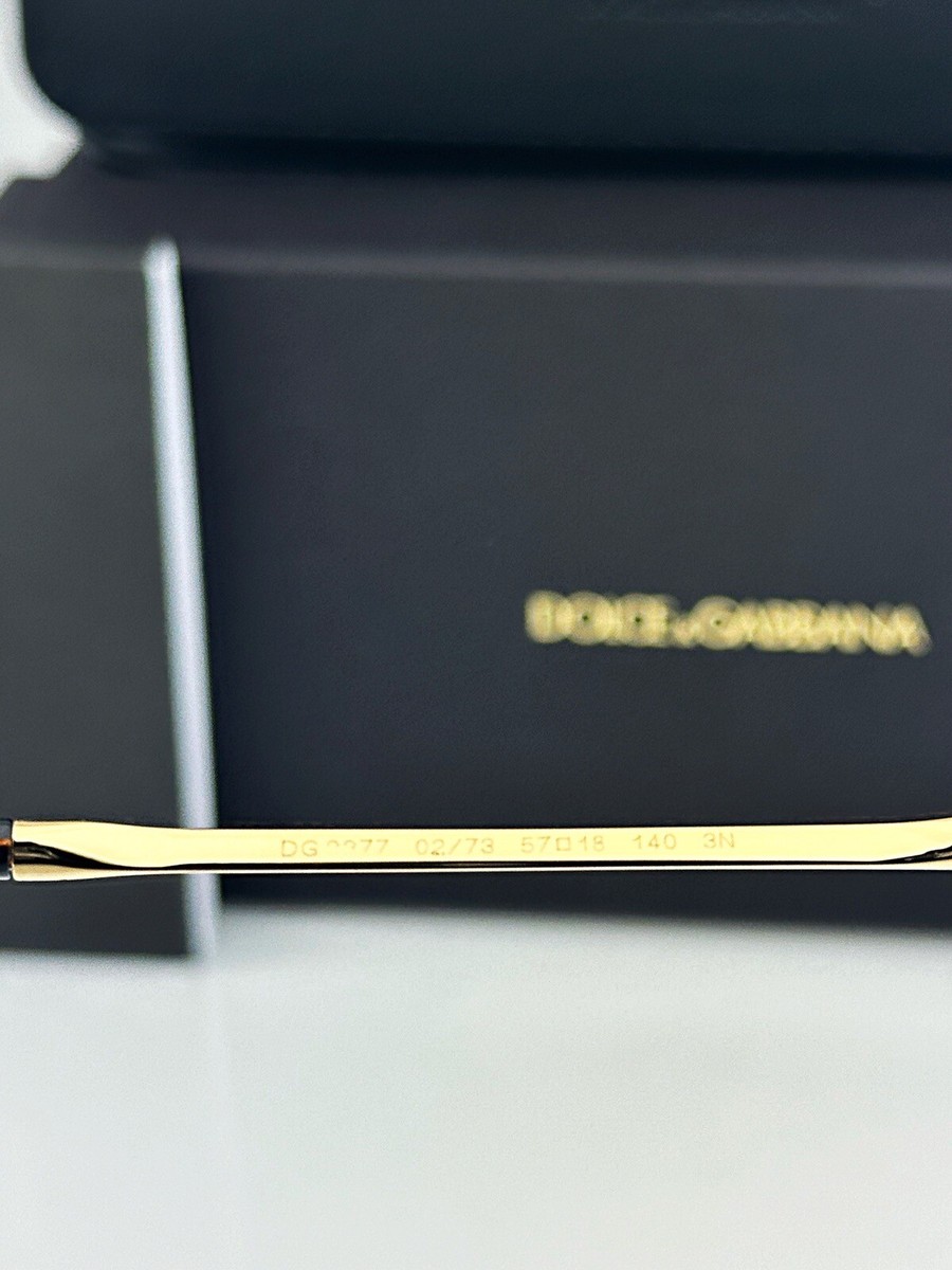 DOLCE & GABBANA DGハトイヤリンク WEQ6L3W1111 ZOO00ORO Ring with DG cut-out logo in Gold for Men | Dolce&Gabbana® US