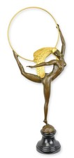 A bonze sculpture of a hoop dancer replica retro design decoration
