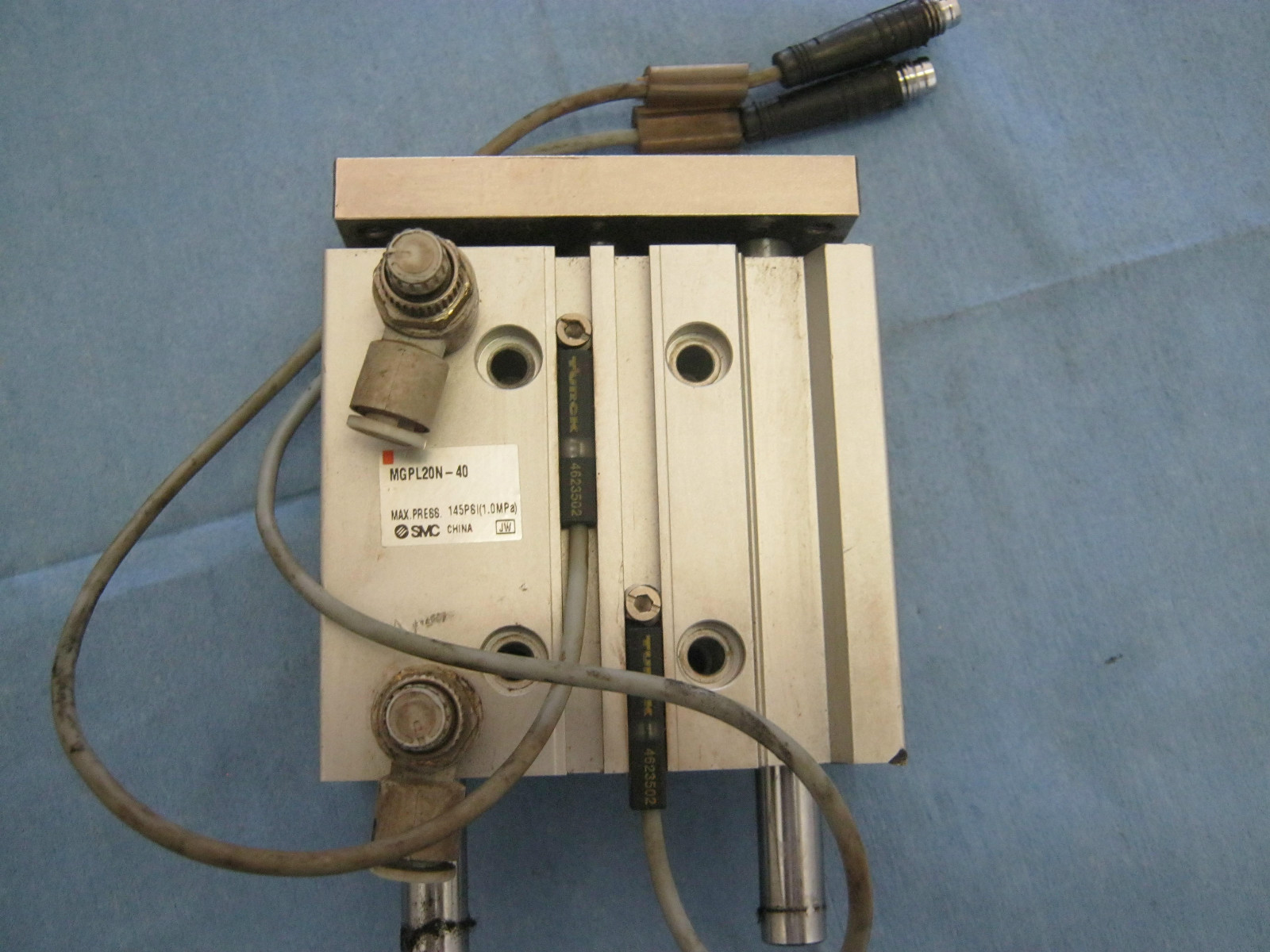 SMC Model: MGPL20N-40 Dual Rod Cylinder w/ (2) Turck 4623502 Prox. Sensors W