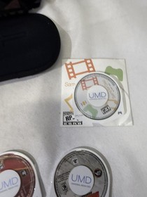 Sony PSP 1001 PlayStation Portable With Charger, new battery and 2 games.Works!!