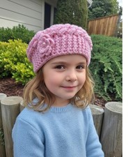 Pink crochet beret with a flower for girl.