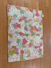 The Land of Nod Pastel Patchwork Quilt bedding set for crib 34x46