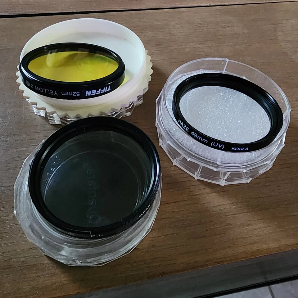 Set Vintage Camera Lenses Tiffen 49mm Yellow, Haze 49mm UV, Quantaray 52mm P.L. - Image 3 of 4