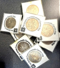 NEW ZEALAND  2 coins  x  1974 DOLLAR COIN in SLEEVE  COMMONWEALTH GAMES UNC