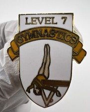 Level 7 Gymnastics Gold Tone Enamel Pin. Lapel. Womens Sports.