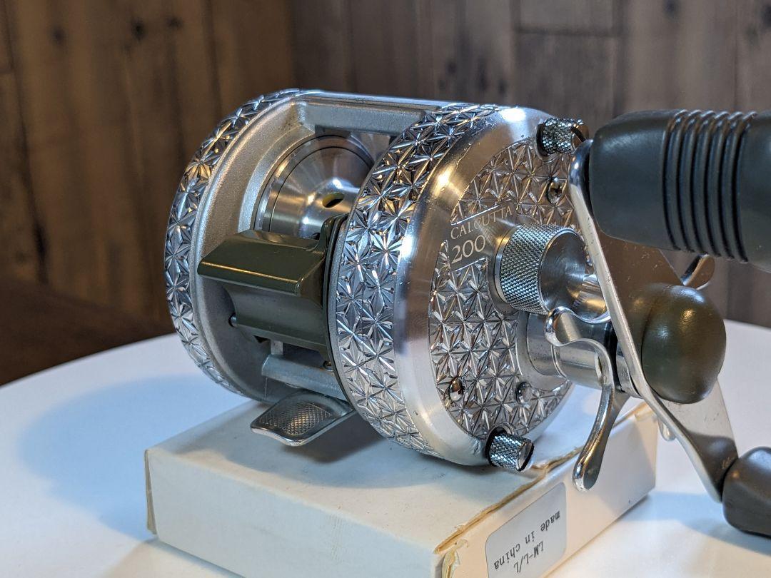 Shimano Calcutta 200 彫金 Engraving custom Shimano Calcutta 200 Engraving Custom Bait Reel Fishing
