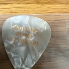 White Pearloid Guitar Pick w/ Gold Print "UNITED WE STAND" - Music — photo 2
