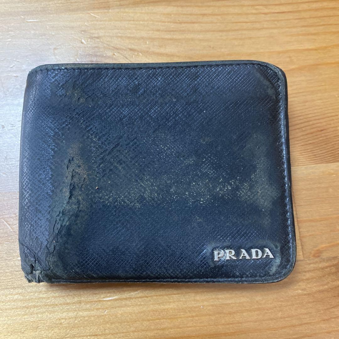 Prada Black Leather Bifold Wallet with 4 Card Slots and 2 Pockets in Excellent Condition