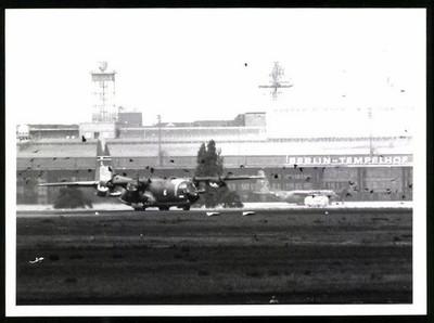 Photograph Berlin Tempelhof Airport, Aircraft Lockheed C-130 Hercules in front of a 