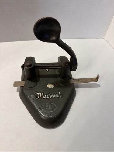Black cast iron Wilson Jones Marvel 60 hole punch with curved handle and flat rectangular base.