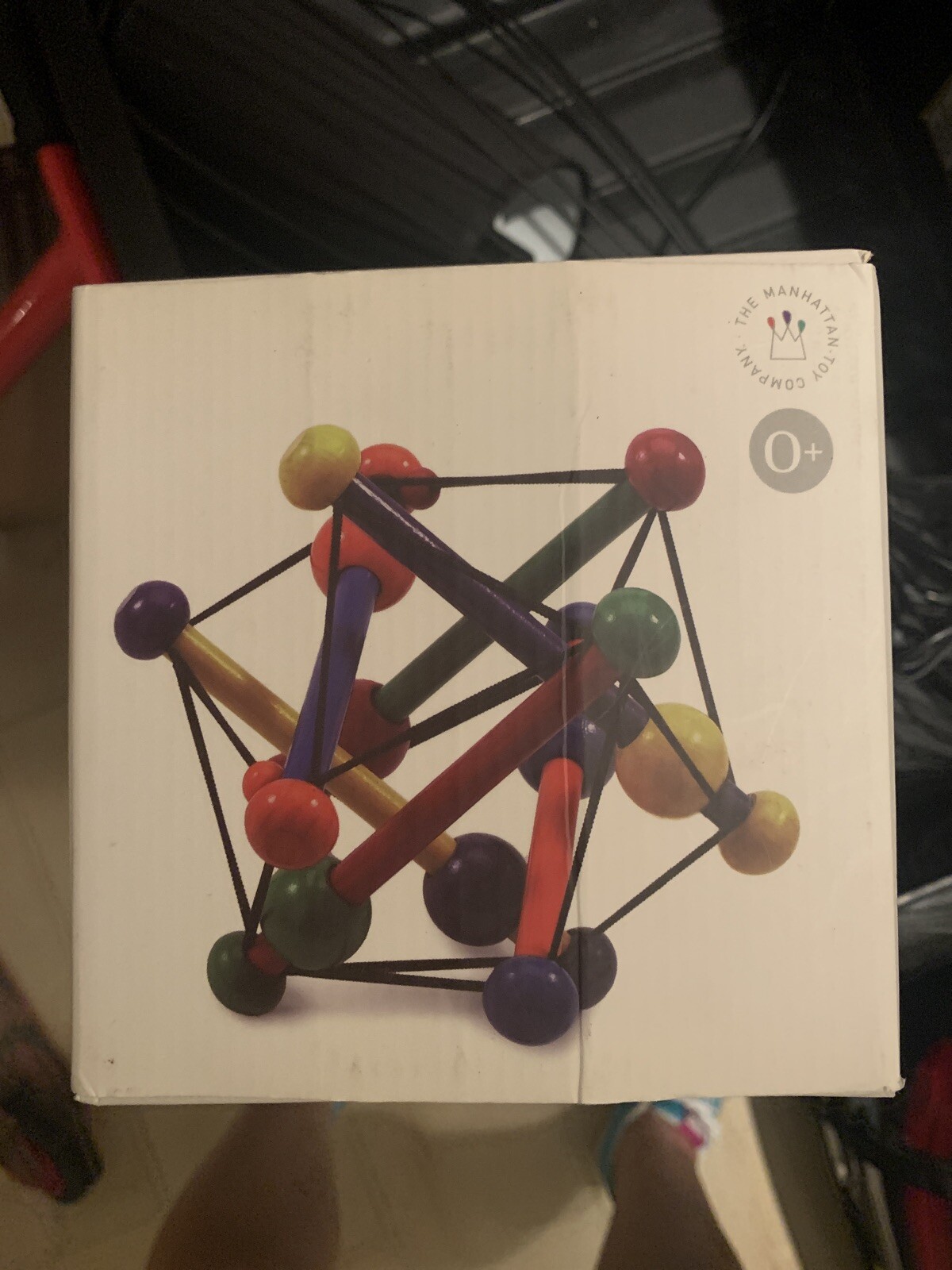 manhattan toy skwish color burst rattle and teether grasping activity toy