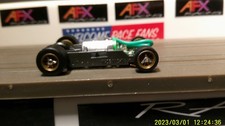 AFX RACING H.O. SCALE MEGA G 1.5 NARROW CHASSIS GOLD RIMS SILVER SPINS LETTS