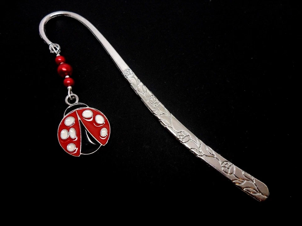 A TIBETAN SILVER LADYBIRD AND RED GLASS BEAD BOOKMARK. NEW.
