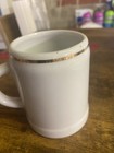 souvenir mug, Goldenes Dachl building and the Tirol coat of arms. — photo 3