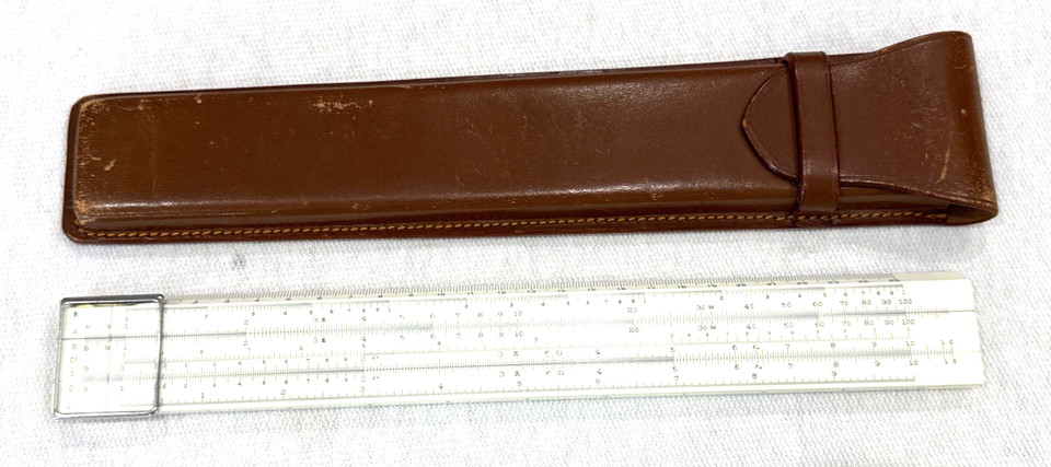A pre-calculator analog computer with a leather case — the kind of precision tool engineers actually used to design the Apollo missions.