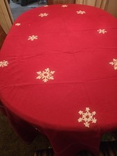 Christmas Tablecloth With White Snowflakes Scattered About. Measures 76"X56".