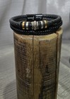 Black braided leather bracelet with silver and gold tone accents modern design — photo 1