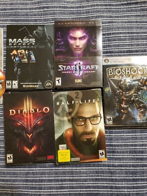 17 Pc Game Lot with Mass effect, starcraft 2, diablo 3, some boxes, some manuals