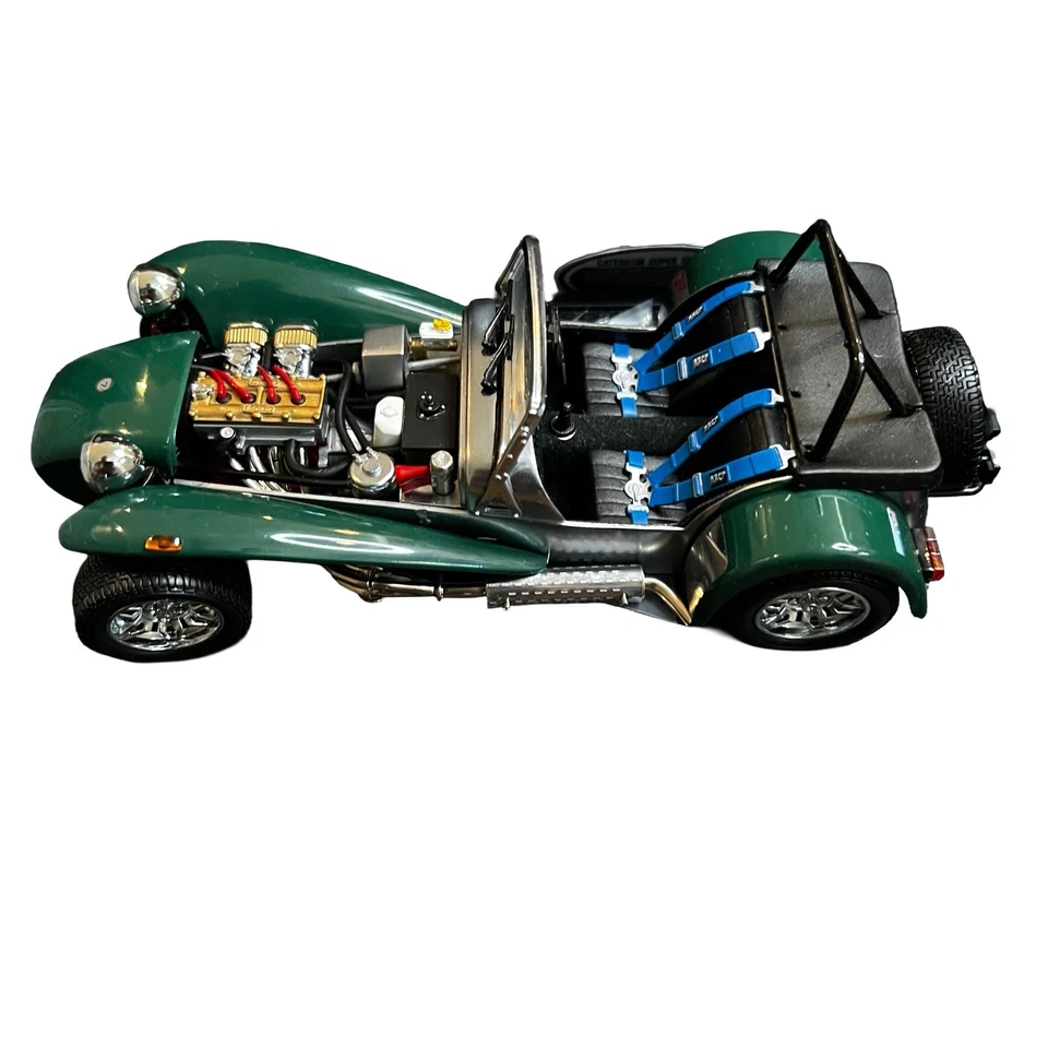 Modelo de coche verde fundido a presión Kyosho escala 1:18 Caterham Super Seven con caja y exhibición Foto 2 de 4