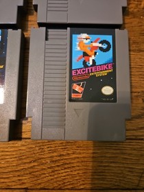 Nintendo NES Console Lot with 2 Controllers, 1 Zapper, 7 Games, and Cords