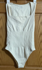 OQQ Women s Beige Sleeveless Bodysuit L Regular Stretch Snap Crotch
