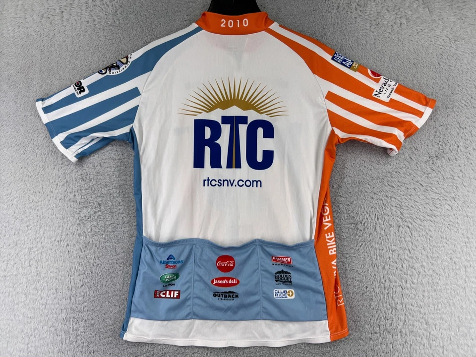 Camiseta deportiva de ciclismo SUGOi para hombre grande naranja azul RTC Viva Bike Las Vegas 2010 1/2 cremallera Foto 2 de 4