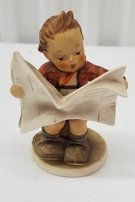 hummel boy reading newspaper