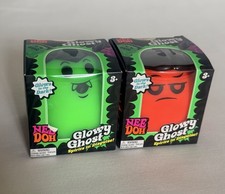 Two Schylling NeeDoh Glowy Ghost Glow-in-the-Dark Squeeze Toy, Green Orange