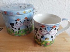Schöner Trinkbecher aus Porzellan mit Kuhmotiv, in passender Metalldose 