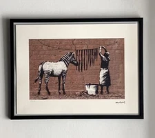 lithographie banksy avec certificat et encadrée 