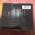 CD back cover of "Affirmation" by Savage Garden with song titles in white text and Columbia 63711 label.