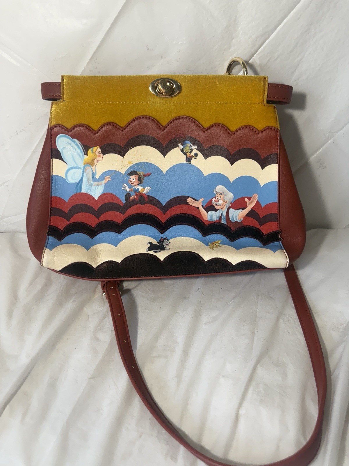 Danielle Nicole Disney Pinocchio Scalloped Handba… - image 1