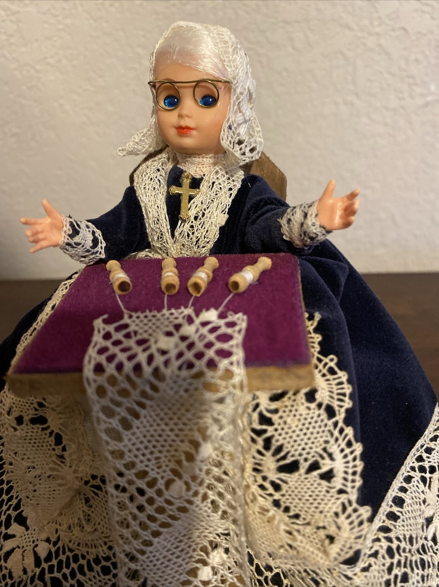 Vintage Belgian doll making lace. 4 inches tall. Eyes blink! Real