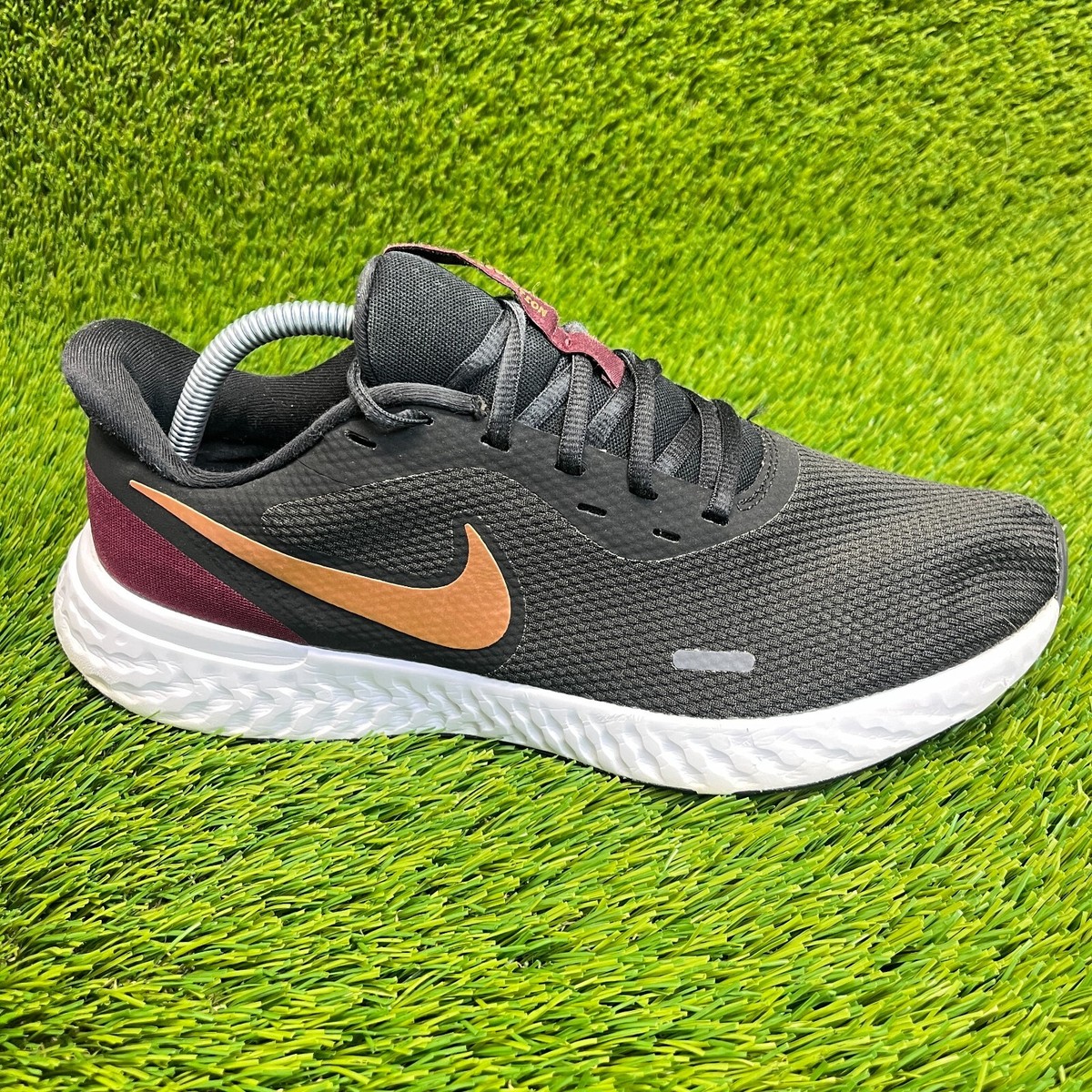 Nike Revolution Womens Size 11 Black Gold Athletic Running Shoes Sneakers