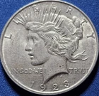 A 1923-d Peace Silver Dollar.  AU+