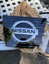 New Pristine Nissan Emblem. Black Panel With Chrome Logo.