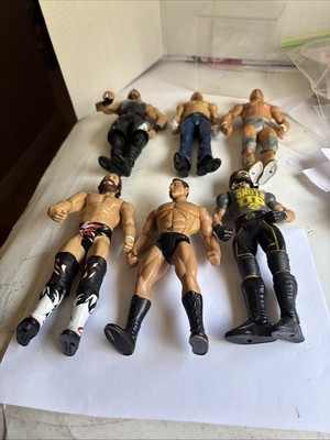 Lot 6 WWE  W W E SIX Wrestling  Figures Used May Smell Loose Limbs