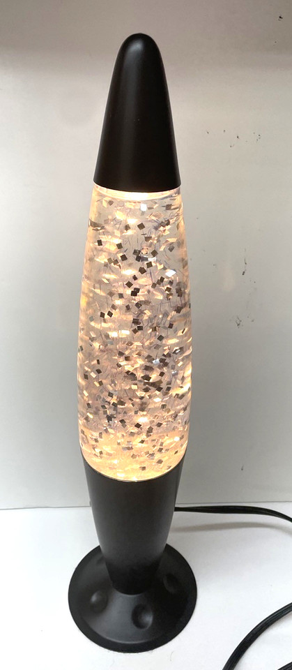 A glitter lava lamp from the early 2000s Y2K sparkle era — rarer and more nostalgia-loaded than a standard wax model.